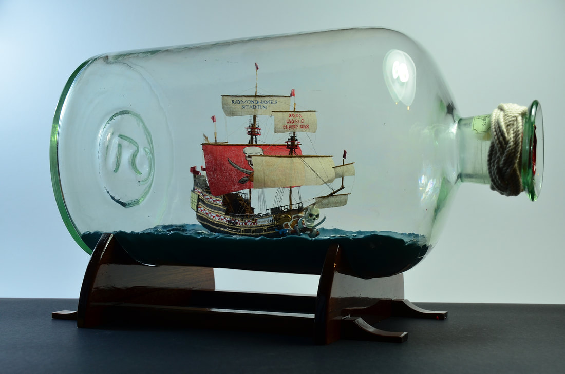 Custom crafted ship in bottle of the Buccaneers Pirate Ship by Gabrielle Rogers