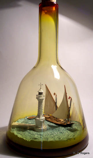 La Neptune and the Phare des Paquis scene in bottle by Gabrielle Rogers
