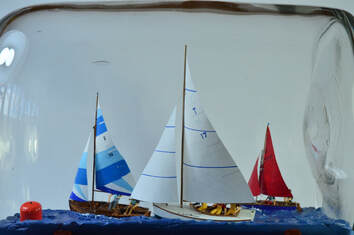 Miniature diorama of three sailing yachts participating in a regatta by artist Gabrielle Rogers